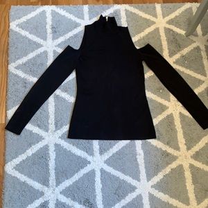 White House Black Market black cold-shoulder mock neck sweater.